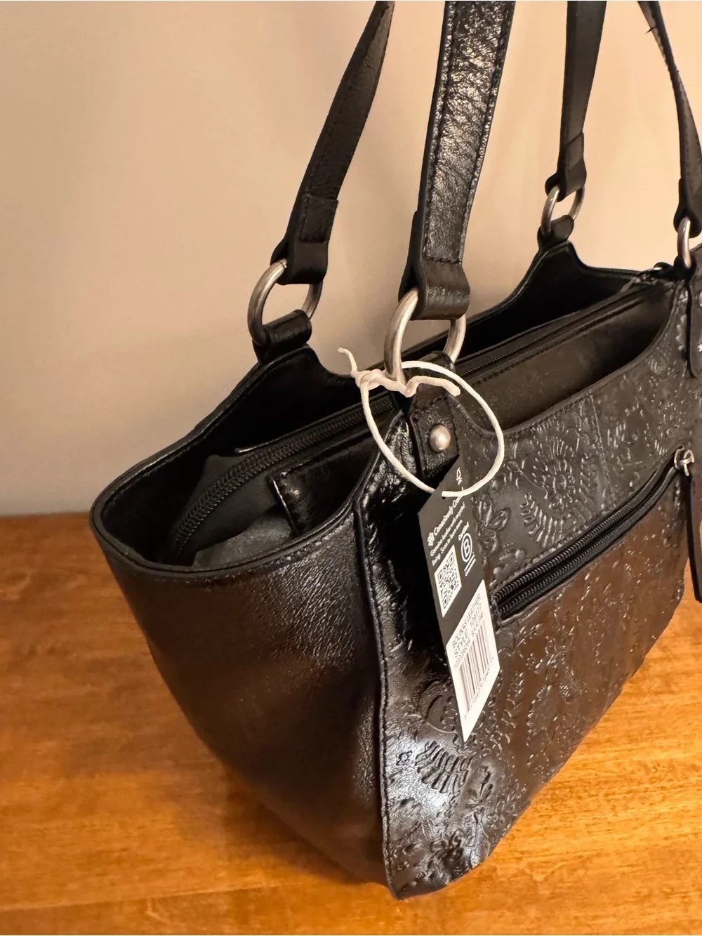 The Sak Bolinas Satchel in Black Floral Embossed Leather